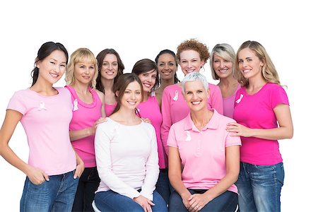 simsearch:400-06932887,k - Cheerful pretty women posing and wearing pink for breast cancer on white background Fotografie stock - Microstock e Abbonamento, Codice: 400-06932886