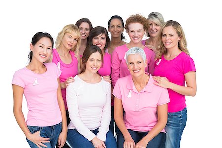 simsearch:400-06932882,k - Voluntary cheerful women posing and wearing pink for breast cancer on white background Stock Photo - Budget Royalty-Free & Subscription, Code: 400-06932889
