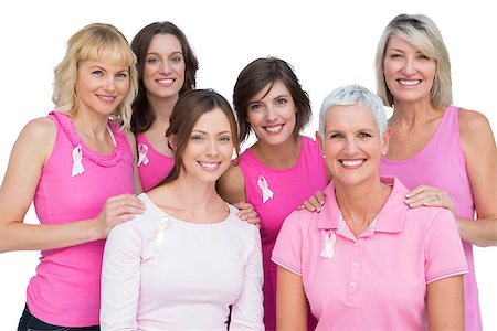 simsearch:400-06932887,k - Smiling women posing and wearing pink for breast cancer on white background Fotografie stock - Microstock e Abbonamento, Codice: 400-06932881