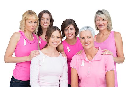 simsearch:400-06932887,k - Happy women posing and wearing pink for breast cancer on white background Fotografie stock - Microstock e Abbonamento, Codice: 400-06932882