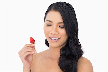 simsearch:693-06021794,k - Natural brown haired model with strawberry on white background Stock Photo - Budget Royalty-Free & Subscription, Code: 400-06933771