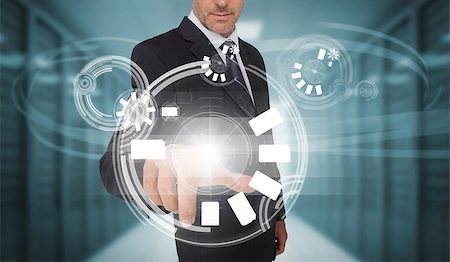 simsearch:400-06886789,k - Businessman touching futuristic circle interface in data center Stock Photo - Budget Royalty-Free & Subscription, Code: 400-06933865