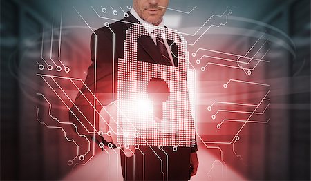 Businessman touching futuristic lock and circuit board interface in data center Stock Photo - Budget Royalty-Free & Subscription, Code: 400-06933875
