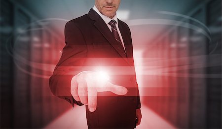 simsearch:400-06933908,k - Businessman touching futuristic red light touchscreen in data center Stock Photo - Budget Royalty-Free & Subscription, Code: 400-06933876