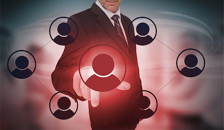 simsearch:400-06933908,k - Businessman selecting futuristic interface of social network icons on blurry office background Stock Photo - Budget Royalty-Free & Subscription, Code: 400-06933895