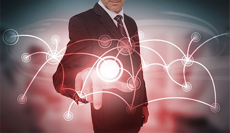 simsearch:400-06933908,k - Businessman selecting futuristic circle with connecting lines interface on blurry office background Stock Photo - Budget Royalty-Free & Subscription, Code: 400-06933893