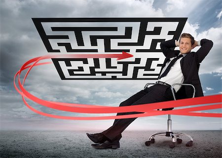 Businessman sitting in front of red arrow through qr code smiling at camera in swivel chair Stock Photo - Budget Royalty-Free & Subscription, Code: 400-06933951