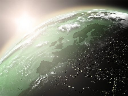 simsearch:400-08371074,k - Space view of the sun rising over Europe on green planet Earth. Elements of this image furnished by NASA. Fotografie stock - Microstock e Abbonamento, Codice: 400-06944460