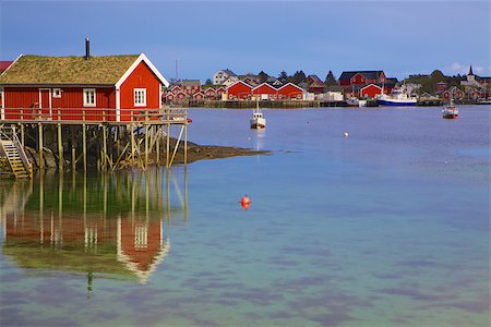 simsearch:400-06946229,k - Typical red rorbu hut in fishing harbour in scenic town Reine on Lofoten islands in Norway Foto de stock - Super Valor sin royalties y Suscripción, Código: 400-06945660