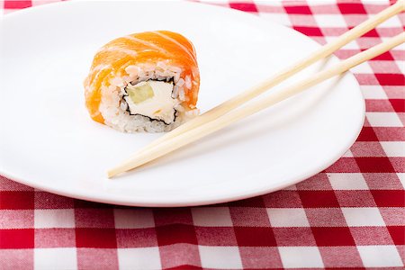 simsearch:689-03123940,k - Sushi, soy and ginger with chopsticks on a white plate Photographie de stock - Aubaine LD & Abonnement, Code: 400-06946847