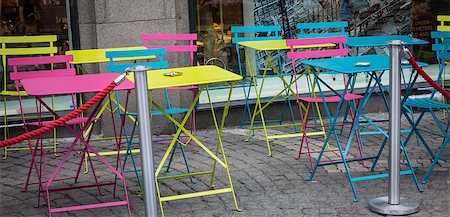 Some colored chairs and table outside a cafe Stock Photo - Budget Royalty-Free & Subscription, Code: 400-06947187