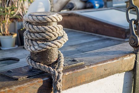 rope deck knot - A rope tied on to a boat Stock Photo - Budget Royalty-Free & Subscription, Code: 400-06947191