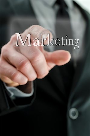 Closeup of businessman finger pushing Marketing button on a touch screen interface. Stock Photo - Budget Royalty-Free & Subscription, Code: 400-06947259