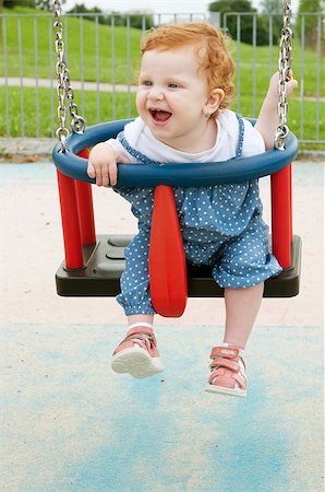 Happy Baby Girl Sitting in the Swing Stock Photo - Budget Royalty-Free & Subscription, Code: 400-06947338