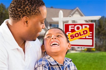 Happy Mixed Race Father and Son In Front of Sold Real Estate Sign and New House. Stock Photo - Budget Royalty-Free & Subscription, Code: 400-06947525