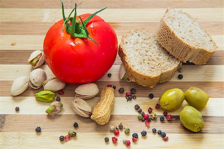 simsearch:824-02888261,k - Healthy concept - Fresh french baguette bread with green olives, tomato and nuts. Wholesome Breakfast Stock Photo - Budget Royalty-Free & Subscription, Code: 400-06947544