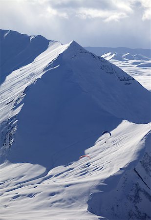 simsearch:400-05157183,k - Speed flying in snowy mountains. Caucasus Mountains. Georgia, ski resort Gudauri. Photographie de stock - Aubaine LD & Abonnement, Code: 400-06947610