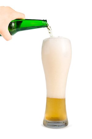 simsearch:400-04719163,k - Hand holding bottle of beer and beer mug. White isolated studio shot. Stockbilder - Microstock & Abonnement, Bildnummer: 400-06947672