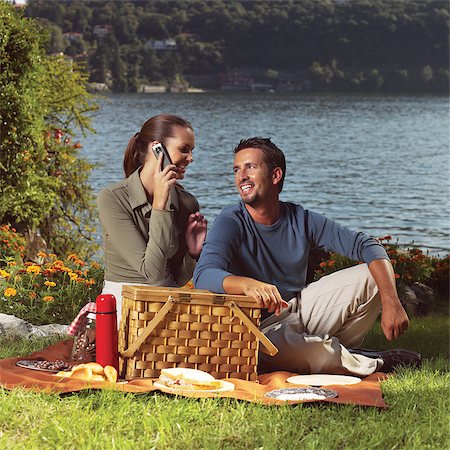 Happy family playing together in a picnic outdoors Stock Photo - Budget Royalty-Free & Subscription, Code: 400-06947792