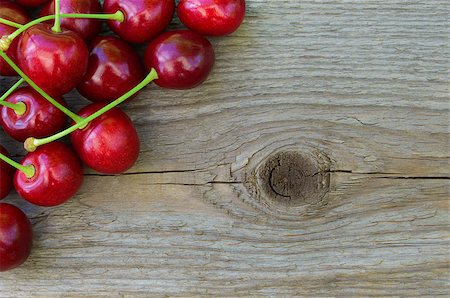 Group of Fresh Ripe Red Sweet Cherries on Wooden Background. Closeup. Space for Text Photographie de stock - Aubaine LD & Abonnement, Code: 400-06948184