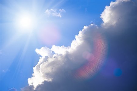 Beautiful Stormy Sky and Bright Sun with Sun Glare Fotografie stock - Microstock e Abbonamento, Codice: 400-06948181