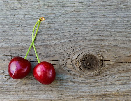 Two Fresh Ripe Red Sweet Cherries on Wooden Background. Closeup. Space for Text Photographie de stock - Aubaine LD & Abonnement, Code: 400-06948183