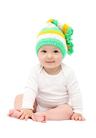 smiling baby sitting on bed Photographie de stock - Aubaine LD & Abonnement, Code: 400-06948330