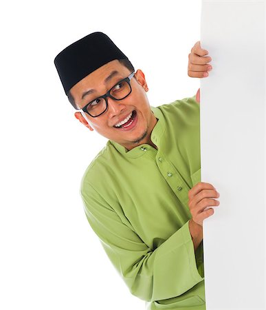 malay male with blank card during hari raya Eid al-Fitr celebration Stock Photo - Budget Royalty-Free & Subscription, Code: 400-06948600