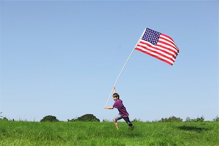 simsearch:400-07558325,k - Patriotic young boy running with a american flag on grenn meadow Photographie de stock - Aubaine LD & Abonnement, Code: 400-06948705