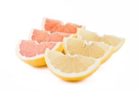 simsearch:400-06862060,k - Juicy white and red grapefruits parts isolated on white Foto de stock - Royalty-Free Super Valor e Assinatura, Número: 400-06948726