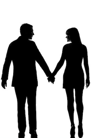 rear view one lovers caucasian couple man and woman walking hand in hand in studio silhouette isolated on white background Stock Photo - Budget Royalty-Free & Subscription, Code: 400-06948981