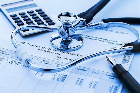 Figuring cost of health care and benefits with stethoscope and calculator in background Fotografie stock - Microstock e Abbonamento, Codice: 400-06949428