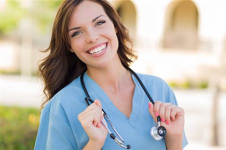 Attractive Young Adult Woman Doctor or Nurse Portrait Outside. Stock Photo - Budget Royalty-Free & Subscription, Code: 400-06949704