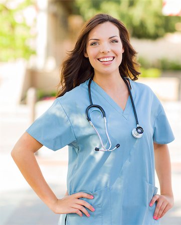 Attractive Young Adult Woman Doctor or Nurse Portrait Outside. Stock Photo - Budget Royalty-Free & Subscription, Code: 400-06949705
