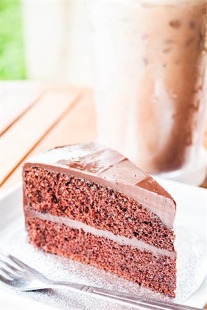 Bitter sweet meal with iced coffee and chocolate cake Stock Photo - Budget Royalty-Free & Subscription, Code: 400-06949738
