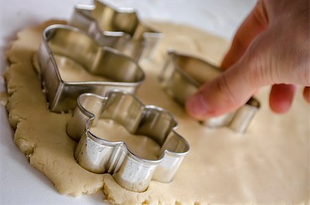 Closeup of a woman's hand making cookies with cutter. Stock Photo - Budget Royalty-Free & Subscription, Code: 400-06949820