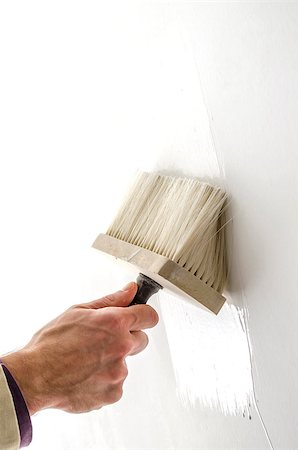 simsearch:400-04349276,k - Closeup of a male hand painting white wall with paintbrush. Stock Photo - Budget Royalty-Free & Subscription, Code: 400-06949845