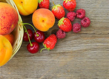 Ripe Sweet Berries and Fruits on the Wooden Table. Space for Text Fotografie stock - Microstock e Abbonamento, Codice: 400-06949902