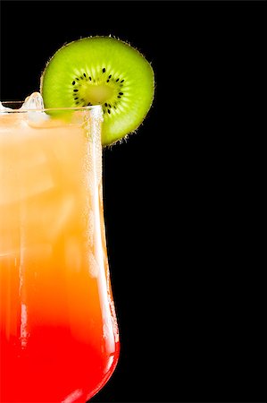 simsearch:400-06797125,k - sex on the beach, fresh orange juice with vodka and cherry juice served in a stem glass on a dark bar Stock Photo - Budget Royalty-Free & Subscription, Code: 400-06954154