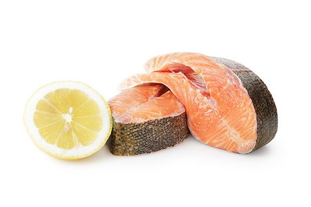 raw fish pieces - fresh trout steaks with lemon, on white background Stock Photo - Budget Royalty-Free & Subscription, Code: 400-06954183