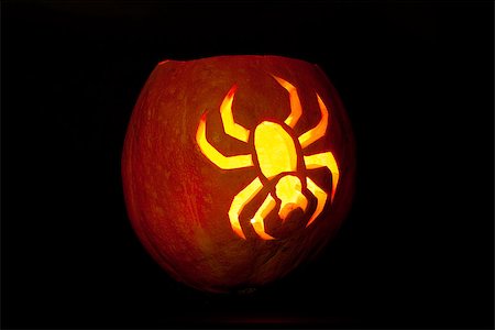 Spider Halloween pumpkin glowing in the dark. Stock Photo - Budget Royalty-Free & Subscription, Code: 400-06954223