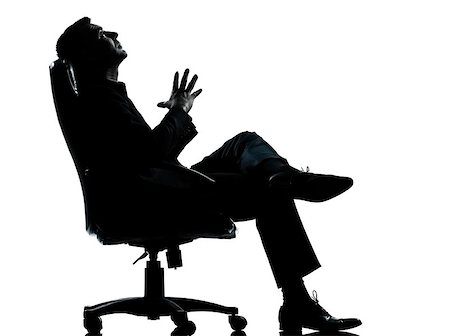 relax businessman silhouette - one caucasian business man relaxing thinking sitting in armchair silhouette Full length in studio isolated on white background Stock Photo - Budget Royalty-Free & Subscription, Code: 400-06954326