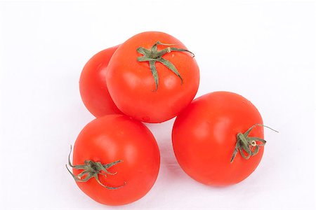 tomatos isolated on a white background Foto de stock - Super Valor sin royalties y Suscripción, Código: 400-06954534
