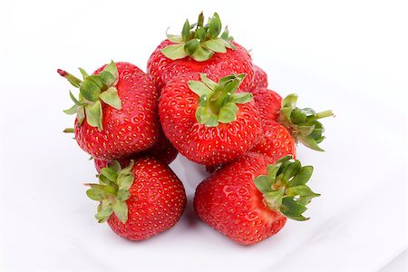 Strawberry fruits isolated on white background Foto de stock - Super Valor sin royalties y Suscripción, Código: 400-06954531