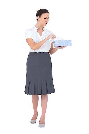 Sad businesswoman holding tissue box while posing on white background Photographie de stock - Aubaine LD & Abonnement, Code: 400-06955192