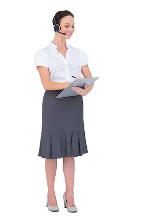 Peaceful call center agent holding clipboard while posing on white background Stock Photo - Budget Royalty-Free & Subscription, Code: 400-06955225