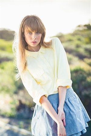 simsearch:400-06956665,k - Timid gorgeous blonde on the roadside posing on a glowing background Stockbilder - Microstock & Abonnement, Bildnummer: 400-06955911