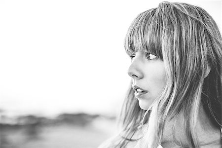 simsearch:400-06956665,k - Hipster girl with fringe looking away in black and white artistic shot Stockbilder - Microstock & Abonnement, Bildnummer: 400-06955937