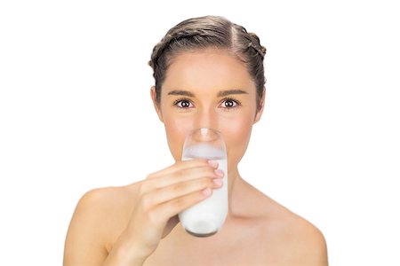 Cute young model drinking milk on white background Foto de stock - Super Valor sin royalties y Suscripción, Código: 400-06956505