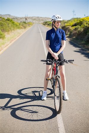 simsearch:400-06956627,k - Active woman with her bike looking away Stock Photo - Budget Royalty-Free & Subscription, Code: 400-06956620